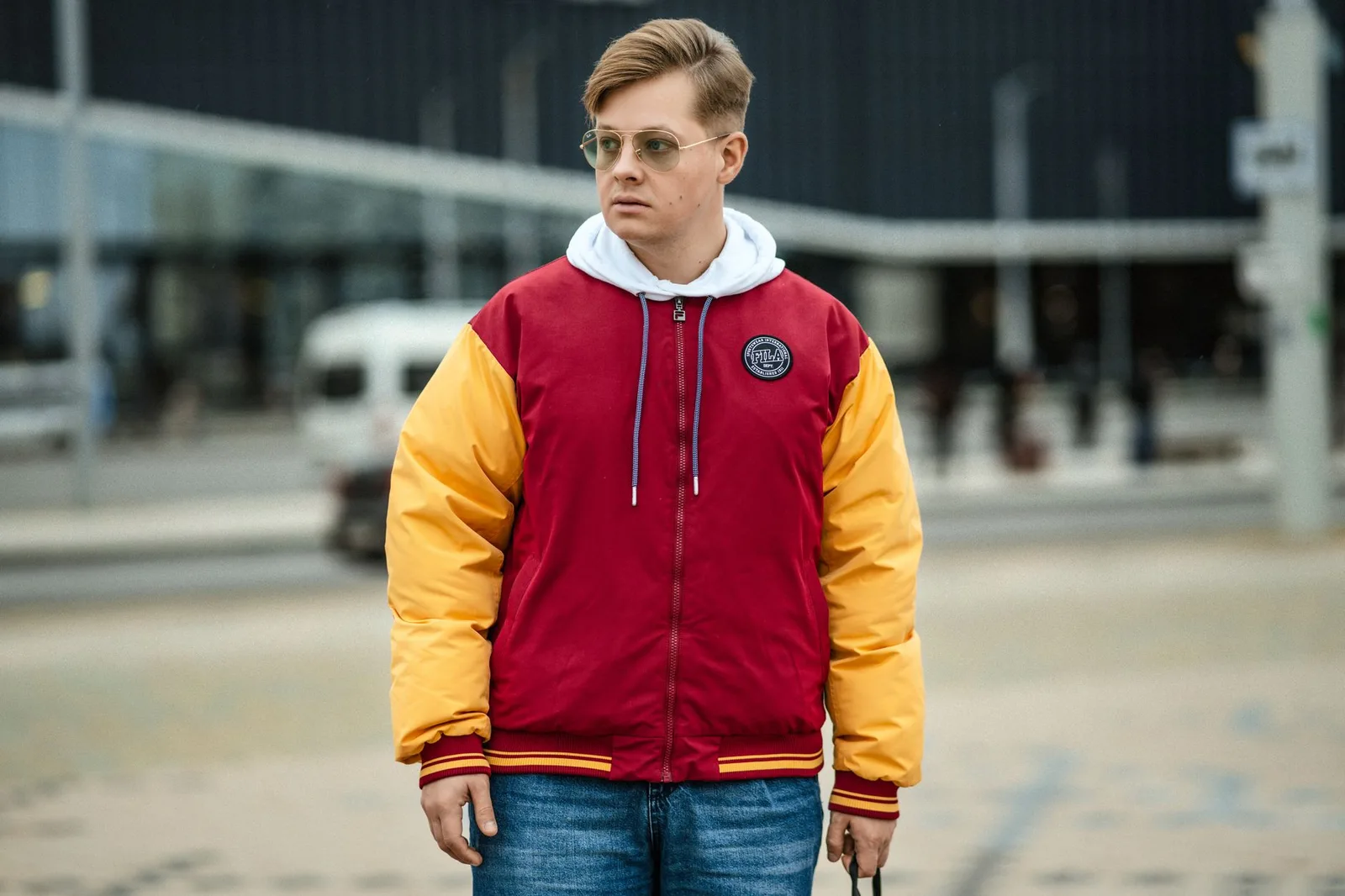 A person wearing a relaxed-fit hoodie with straight-leg trousers
