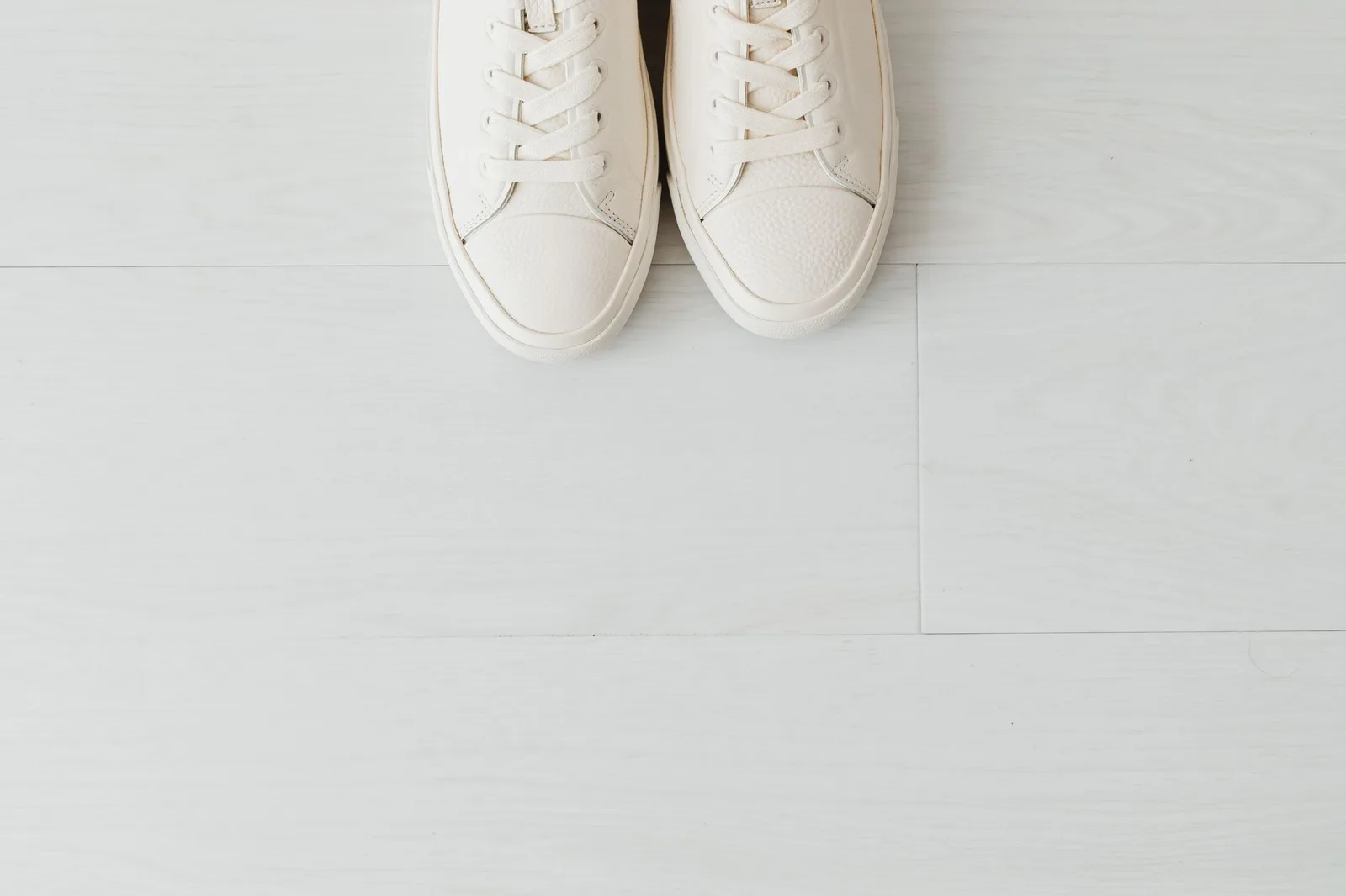 Several pairs of sneakers arranged in a row