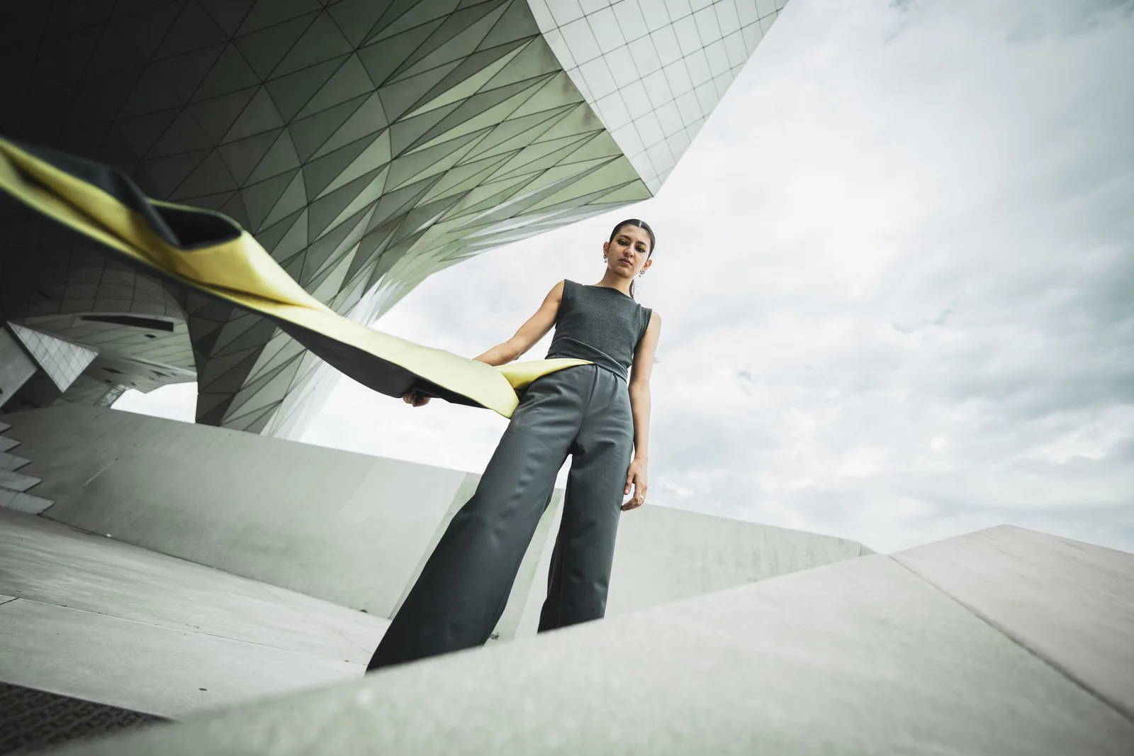 An outfit pairing a fitted top with wide-leg trousers