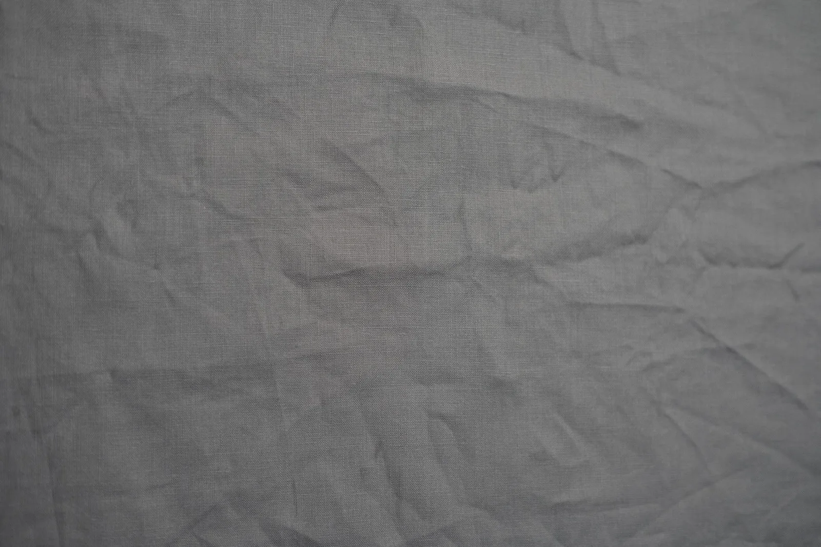 Close-up of soft grey fleece fabric showing its texture