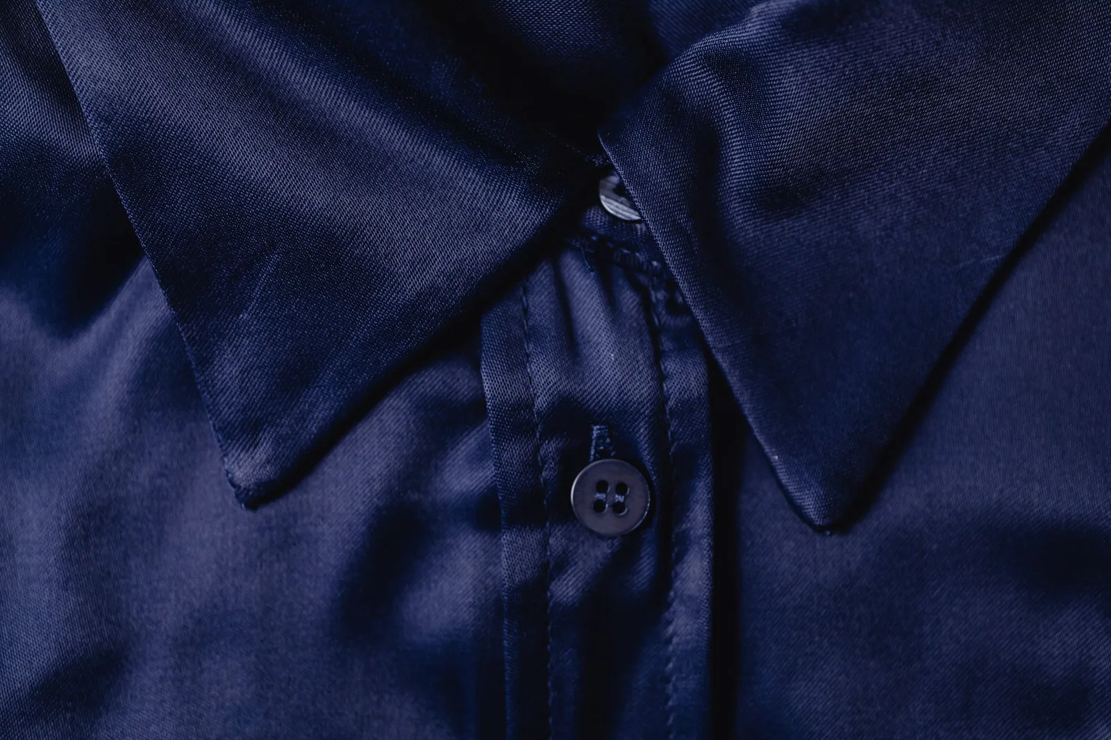 The shoulder seam of a shirt where it meets the sleeve