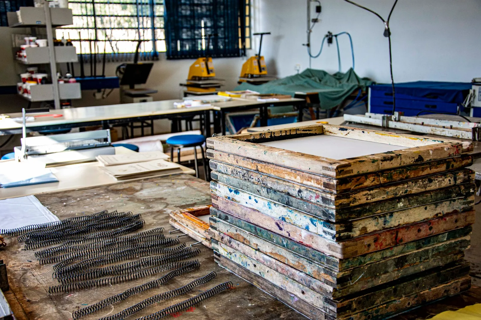 A screen printing setup in a small apparel workshop